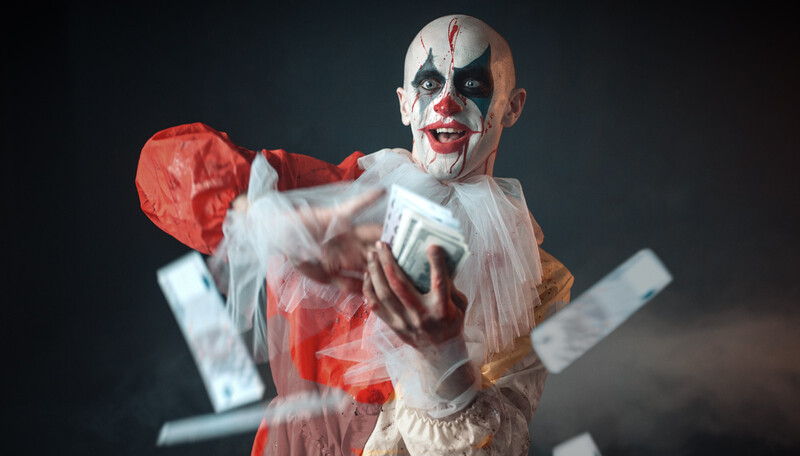 Clown character with white face paint and black accents, wearing red and white costume, captured mid-motion with motion blur effect.