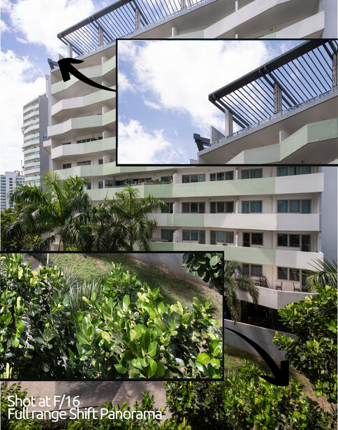 Modern residential building with horizontal balconies framed by overhanging architectural elements and tropical vegetation.