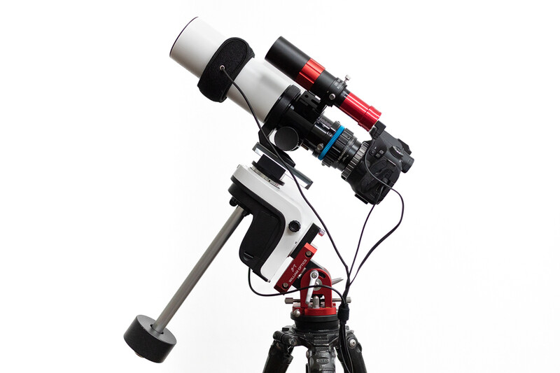 Telescope with camera and filter wheel mounted on red equatorial tracking mount against white background.