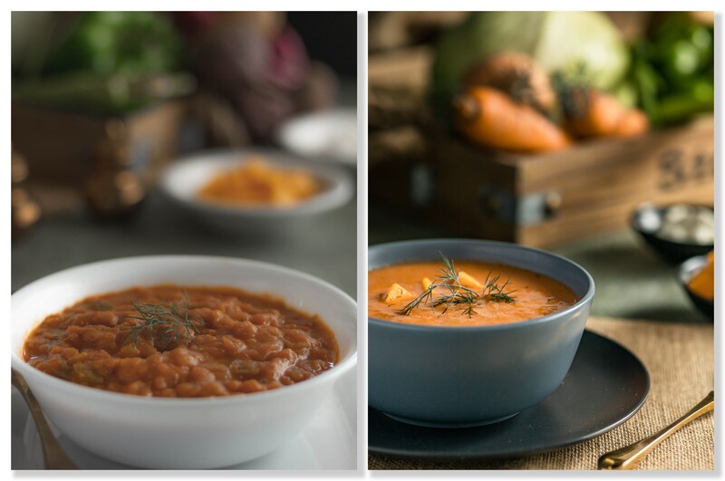 Two bowls of tomato soup with rosemary garnish in a styled food photography setup.