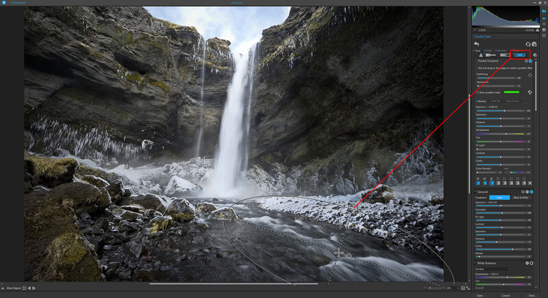 Screenshot of photo editing software displaying a long-exposure waterfall landscape with rocky terrain.