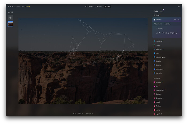 Screenshot of photo editing software showing a rocky cliff formation with wireframe overlay and editing tools panel.