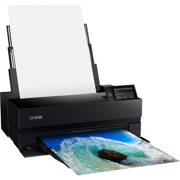 Epson SureColor photo printer with dual antennas outputting a vibrant landscape photograph.