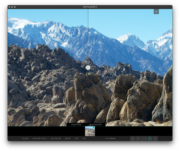 Screenshot of photo editing software displaying a landscape image of rocky terrain with snow-capped mountains.