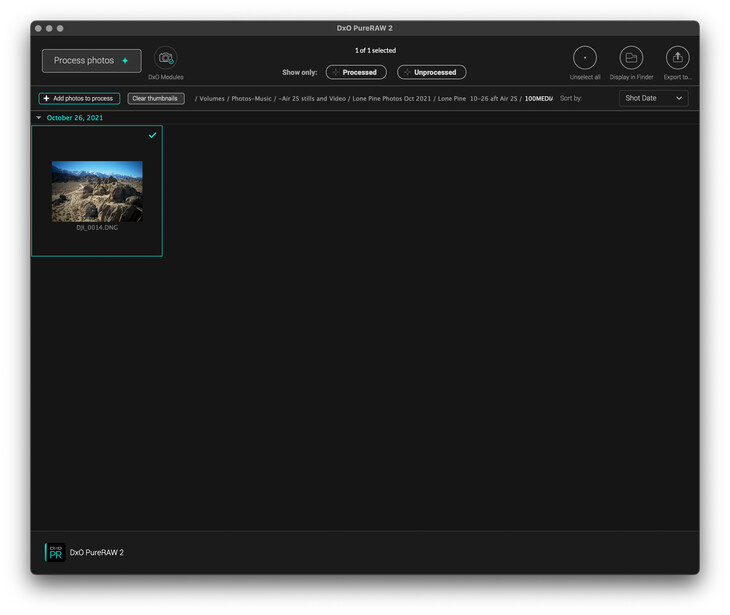 Screenshot of photo editing software showing an aerial landscape image in the left panel with editing controls visible in the interface.