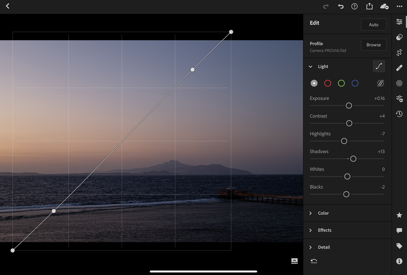 Screenshot of photo editing software showing a coastal sunset landscape with curve adjustment tool active.