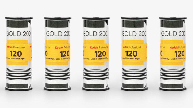 Five identical Kodak Gold 200 film canisters arranged in a row against a white background.