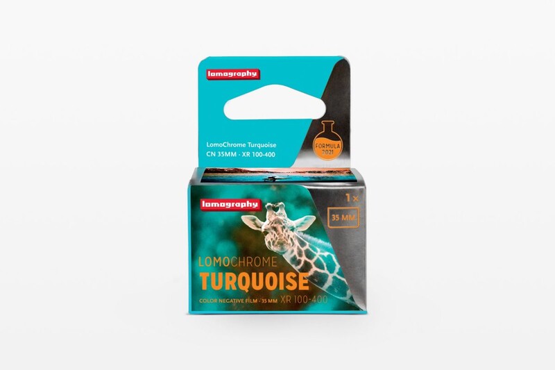 Lomography Lomochrome Turquoise film package showing product box and blue packaging against white background.