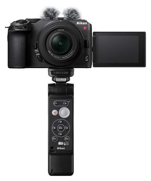 Nikon Z30 mirrorless camera with attached microphone and grip handle, shown with articulating touchscreen extended.