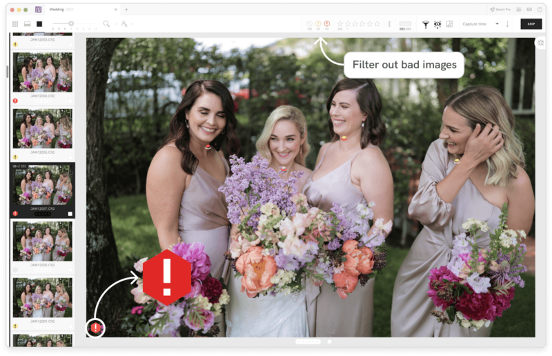 Four bridesmaids in lavender dresses holding purple and coral bouquets outdoors.