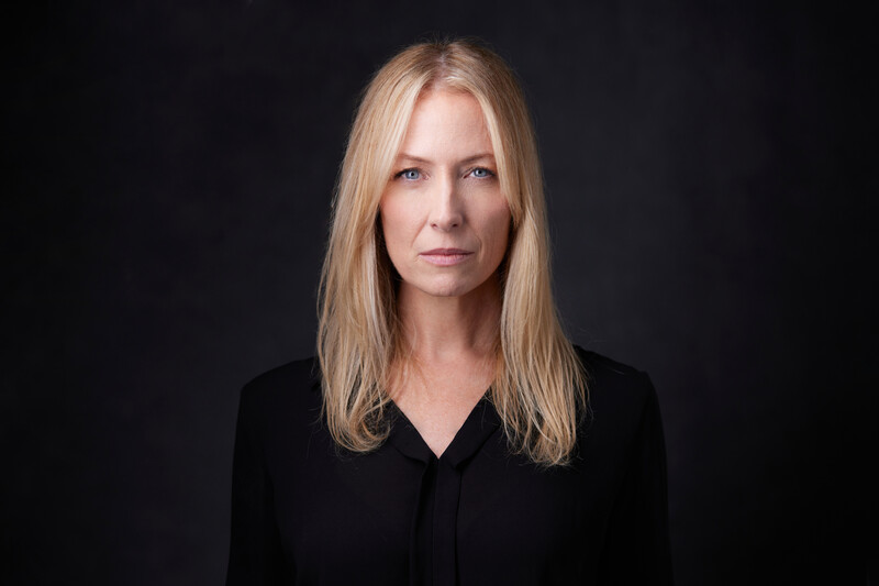 A headshot of Regina, an actor.
