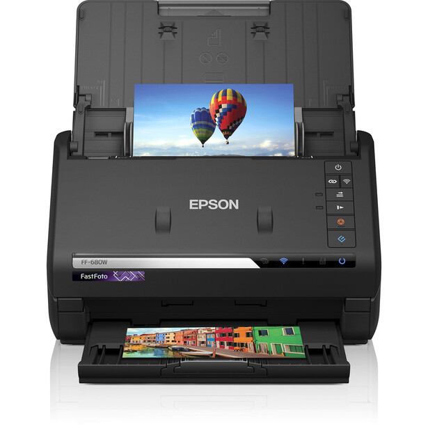 Epson FastFoto scanner with display showing hot air balloons and colorful photos in the tray.