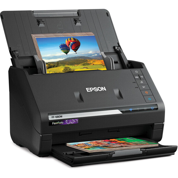 Epson FastFoto document scanner with photo displayed on its lid.