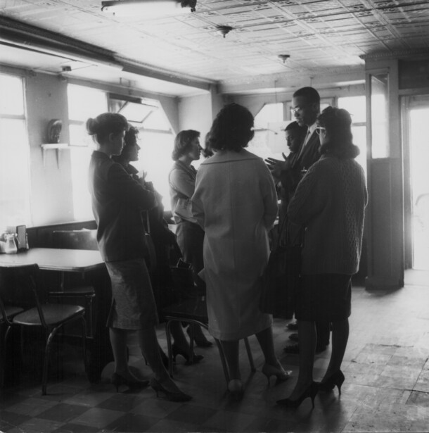 Malcolm X talking to supporters.