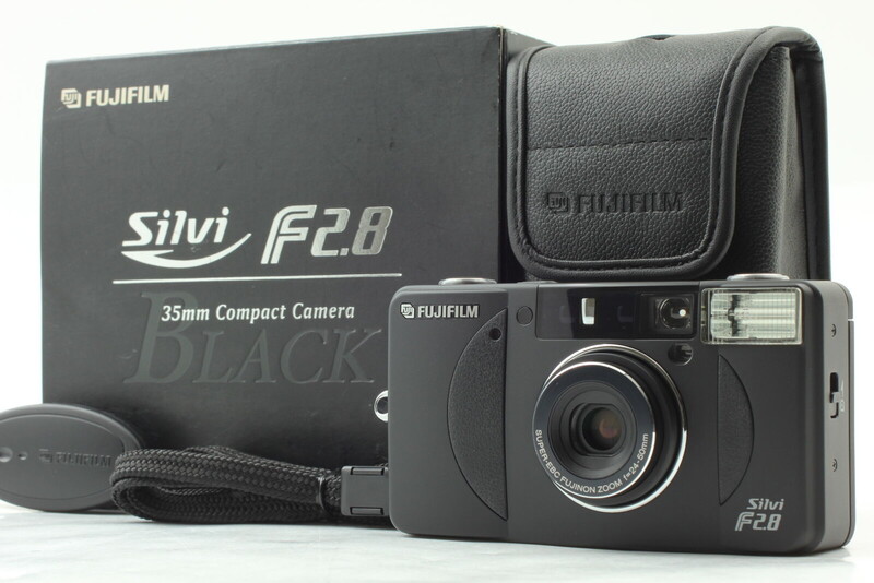 Fujifilm Silvi F2.8 35mm compact camera with original box, carrying case, and strap displayed together.