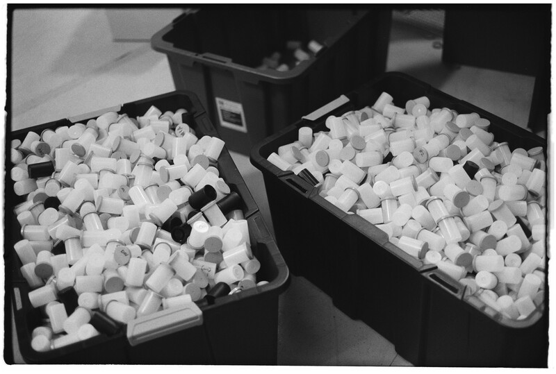 Two black trays filled with white foam packing peanuts arranged side by side.