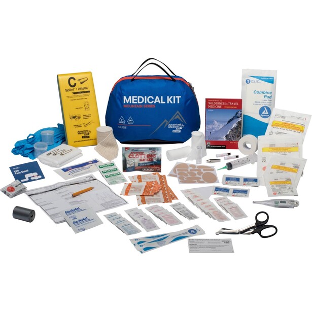 Comprehensive medical emergency kit with blue carrying case, bandages, medications, and first aid supplies organized on white surface.