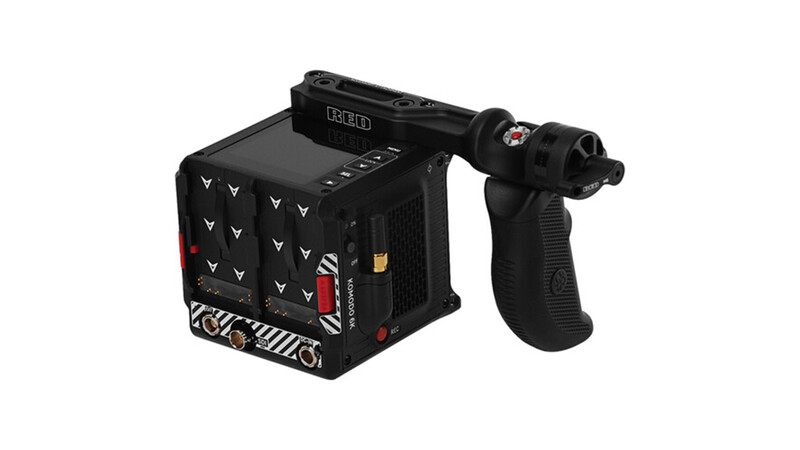 Black cinema camera with articulating handgrip and control panel featuring buttons and indicators.