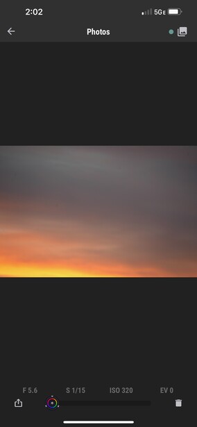 Dramatic sunset gradient transitioning from deep orange near horizon to dark sky above.