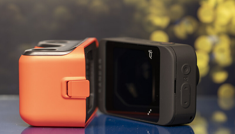 A view showing how the viewfinder snaps on to the back of the camera. The Q button in the corner gained some added functionality in later firmware updates to lock the screen and save battery.