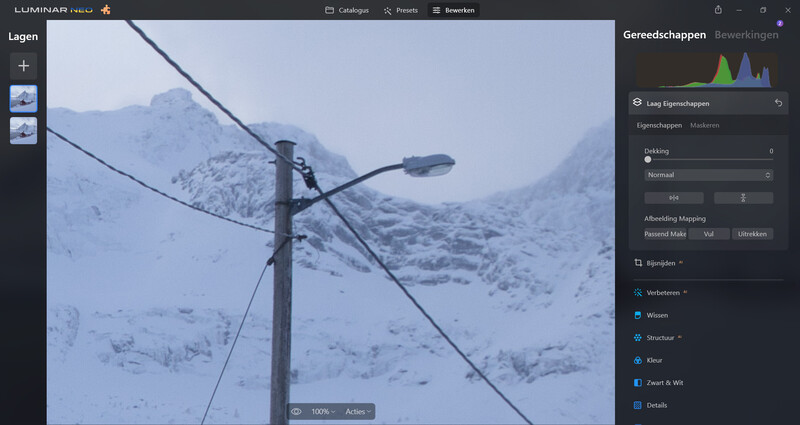 Screenshot of Luminar Neo photo editing software showing a snow-covered mountain landscape with utility pole in foreground.