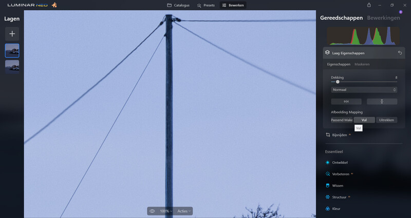 Screenshot of photo editing software showing a bridge structure with cables against a blue sky, with adjustment panels visible on the right side.