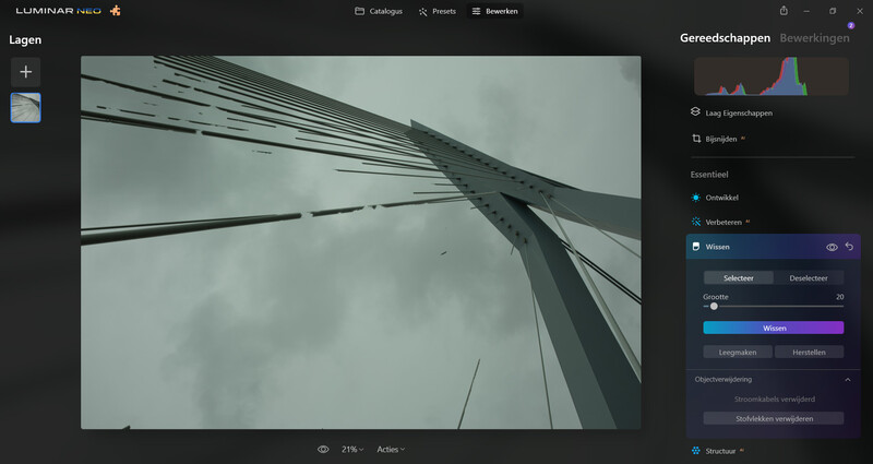 Screenshot of Luminar Neo editing interface with architectural photograph of bridge cables against overcast sky.