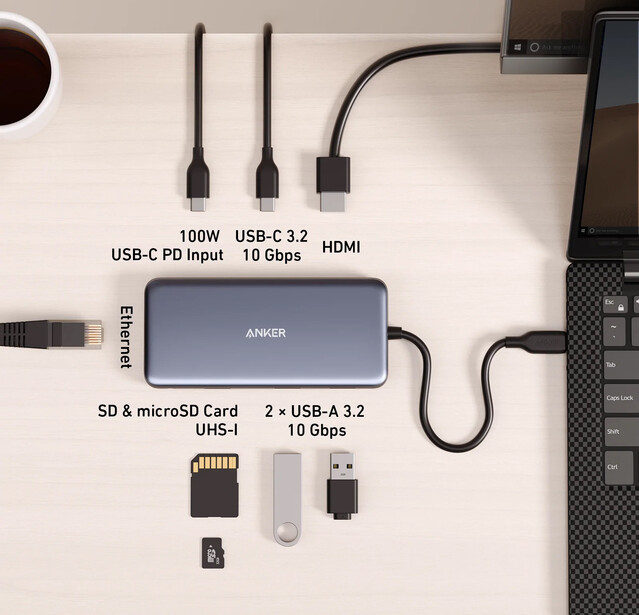 Anker USB-C hub with multiple ports displayed alongside compatible cables and memory cards.