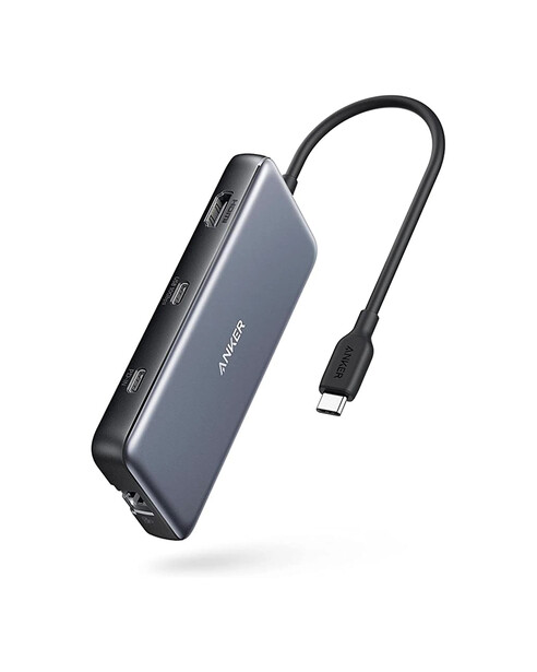 Gray USB-C docking station with attached black cable against white background.