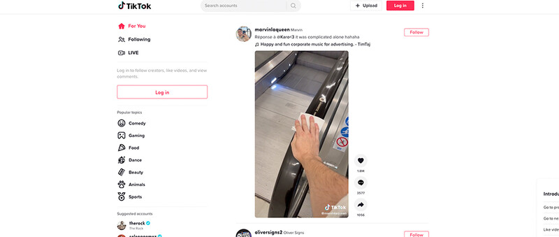Screenshot of TikTok interface showing a user's hand interacting with a smartphone displaying video content.