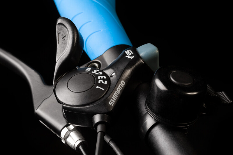 Same image of bicycle gear shift on handlebar. This time with dust specs removed