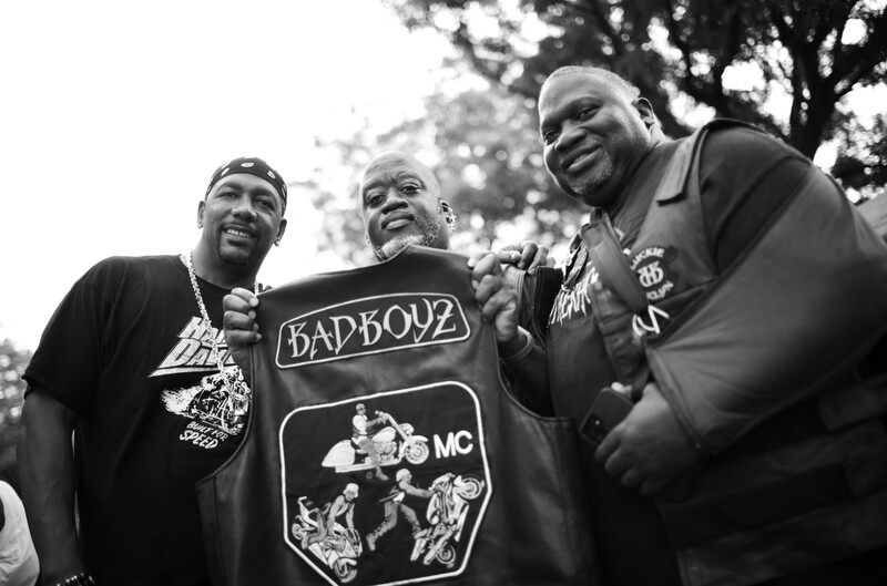 Motorcycle riders holding leather vest