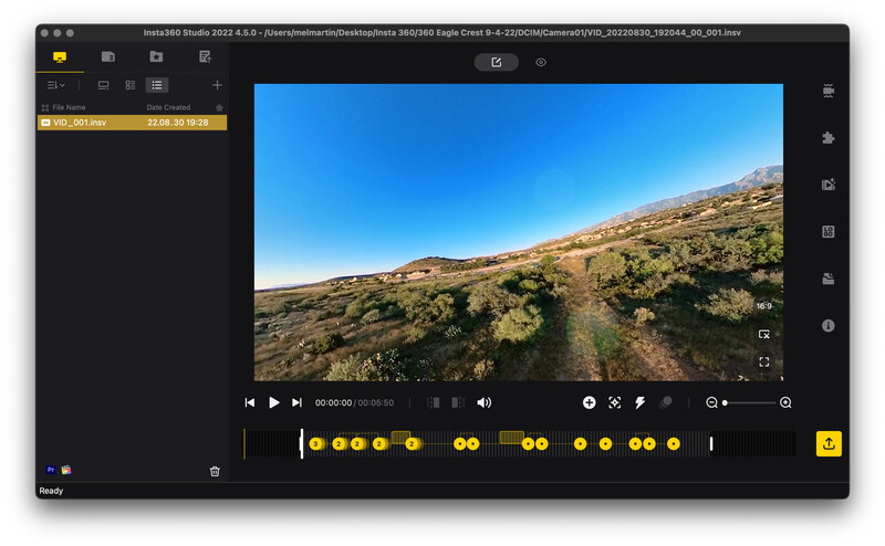 Screenshot of DaVinci Resolve video editing software displaying a landscape footage preview with timeline and color grading controls.