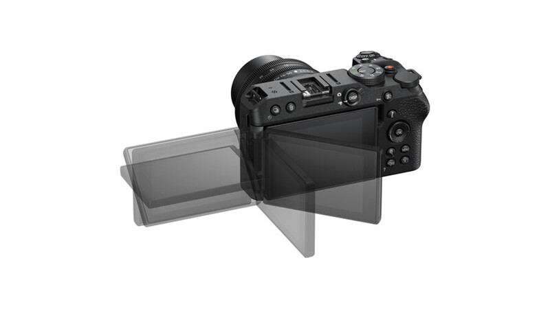 Mirrorless camera with articulating LCD screen extended outward and upward.