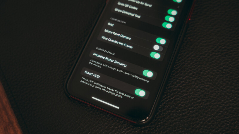 Screenshot of smartphone camera settings menu with multiple toggles enabled in green.