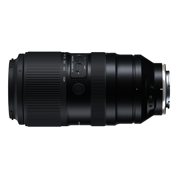 Black telephoto lens with focus ring and distance scale markings displayed against white background.