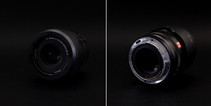 Two camera lenses photographed against a black background, showing front and rear optical elements.