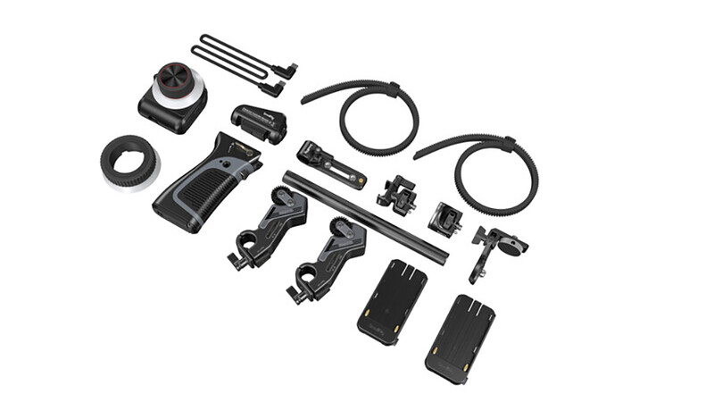 Complete camera accessory kit with mounts, cables, and mounting hardware laid out on white background.