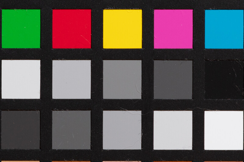 Color reference chart with five saturated hues and grayscale gradient scale for exposure and white balance calibration.