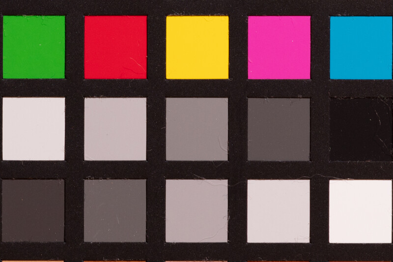 Color reference chart with five vibrant hues in the top row and graduated grayscale swatches below.