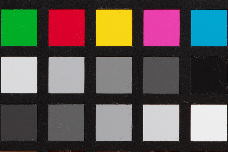 Color checker reference chart with five colored squares across the top row and grayscale patches below.