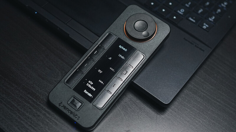 Camera control panel with dial and preset buttons on dark wooden surface.