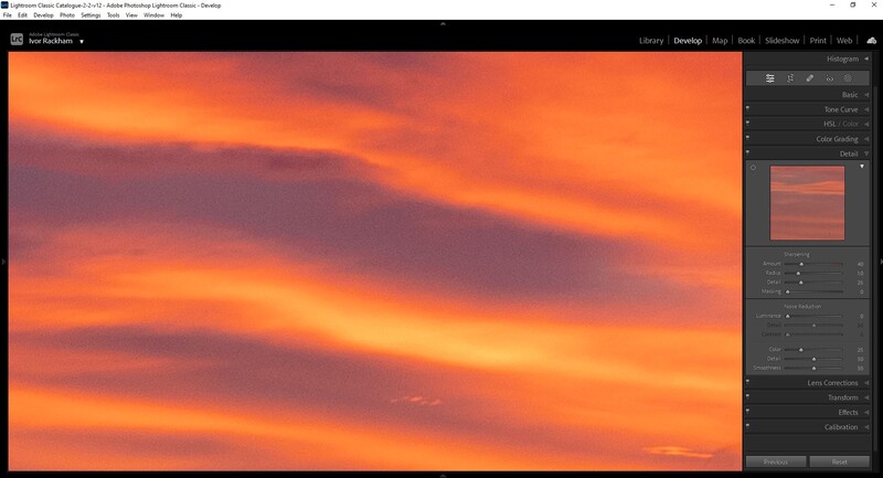 Vibrant orange and purple sunset sky with layered clouds during golden hour.