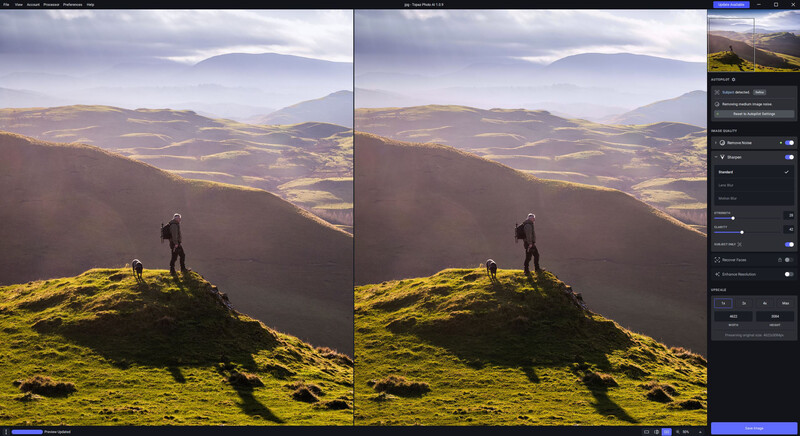 Hiker standing on moss-covered hillside overlooking vast patchwork valley landscape with mountains in distance.