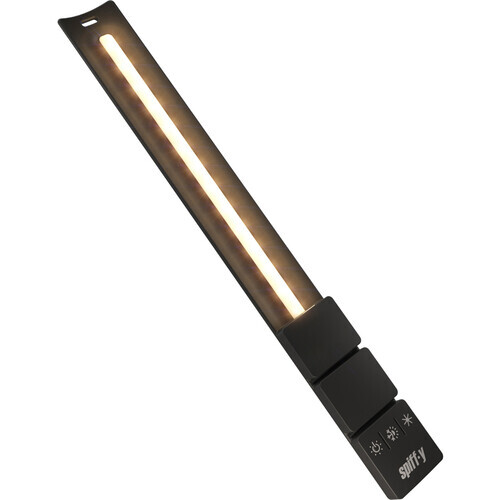 Elongated LED panel light with warm glow and black control module at base.