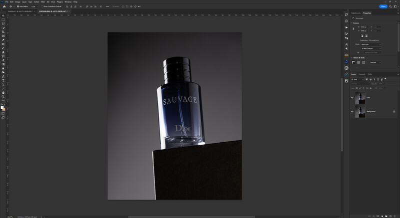 Dior Sauvage fragrance bottle positioned on a black geometric platform against a gradient gray background.