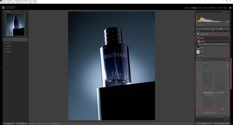 Screenshot of photo editing software displaying a product photograph of a dark blue fragrance bottle backlit against a gradient blue background.