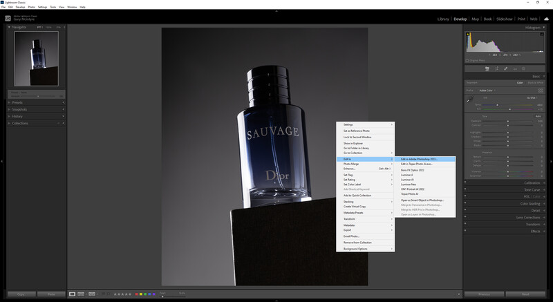 Screenshot of photo editing software showing product photography of a dark fragrance bottle on a black platform with editing panels and adjustment dialogs open.