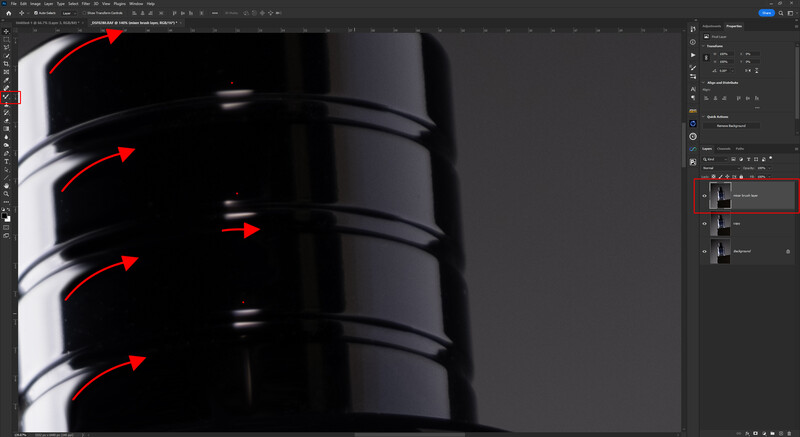 Screenshot of Photoshop with red arrows pointing to curved highlights on a cylindrical black object.
