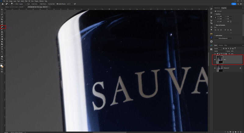 Screenshot of Photoshop with a 3D rendered bottle displaying white text on dark blue surface.